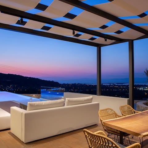 Sip on your favourite cocktail as you take in cotton candy sunsets