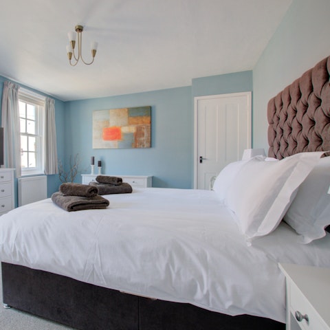 Wake up to views of the lighthouse from the king-sized bedroom