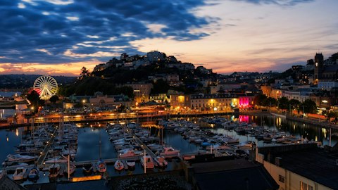 Explore Torquay Harbour's vibrant waterfront, a twelve-minute drive