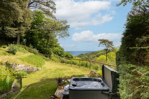 Soak in the hot tub as the coast stretches out ahead
