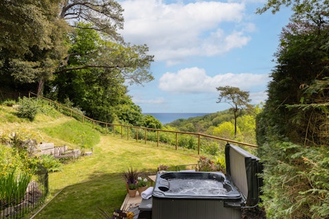 Soak in the hot tub as the coast stretches out ahead