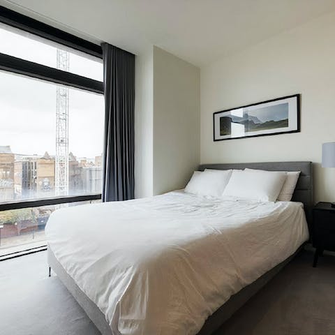 Wake to sunlight streaming in through the massive window in the bedroom