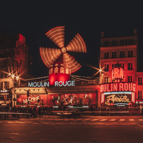 Catch a show at the iconic Moulin Rouge, located close by