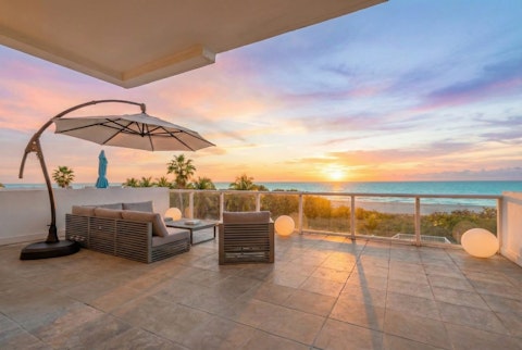 Watch the sky turn gold above the Atlantic from your terrace