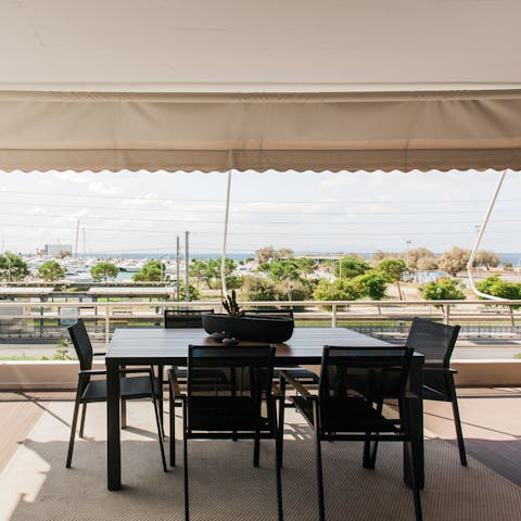 Gather around the chic dining table, shady beneath the canopy, for super fresh barbecue dinners