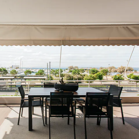 Gather around the chic dining table, shady beneath the canopy, for super fresh barbecue dinners