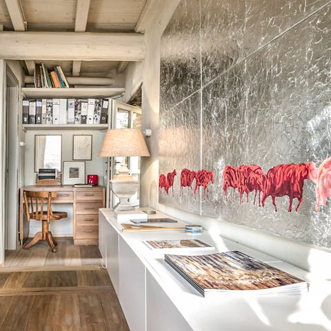 Admire the modern artworks and get some work done at the dedicated office nook