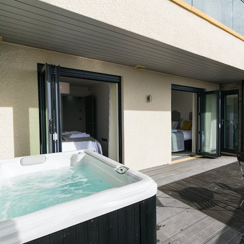 Soak in the luxurious hot tub for two