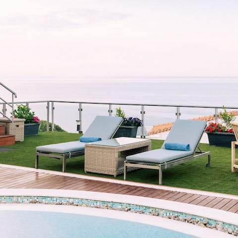 Grab a magazine and relax on one of the plush sun loungers