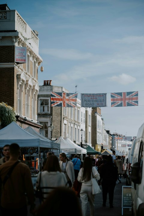 Shop for vintage treasures at Portobello Road Market, a seventeen-minute walk