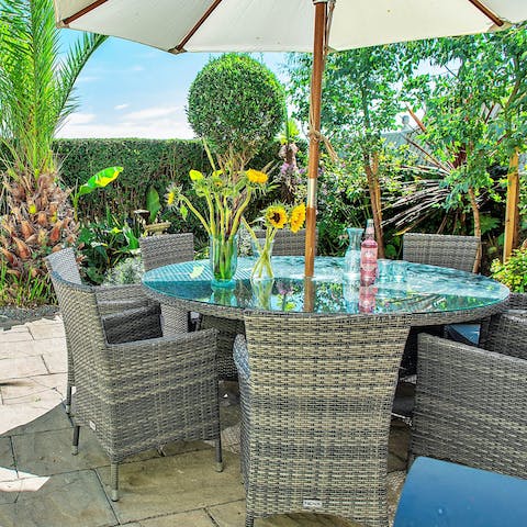 Get together at the shaded table for gin & tonic o'clock