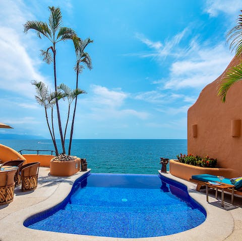 Dip your toes into the heated infinity pool each morning