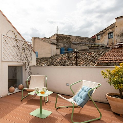 Sprawl out on the rooftop terrace with a glass of local wine