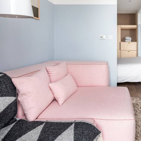 Kick back and relax on the cosy sectional sofa with a glass of wine