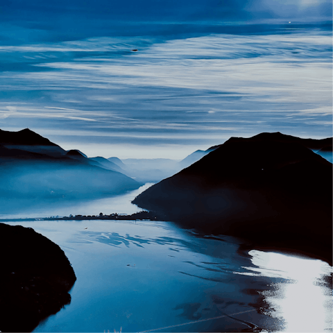 Explore Lago Lugano by boat – your host can provide one