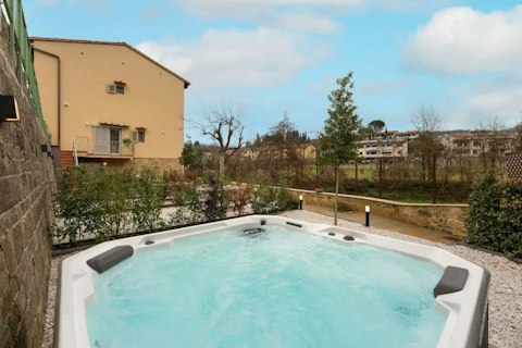 Soak in the shared hot tub, glass of Chianti in hand