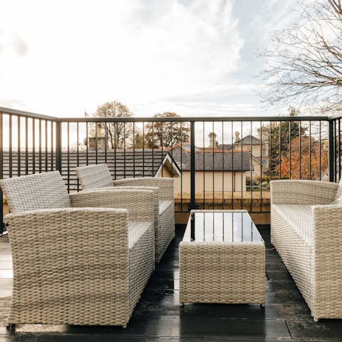 Enjoy a sundowner on the private balcony overlooking the communal gardens