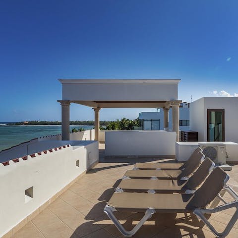 Watch the sunset over the bay from the secluded rooftop terrace