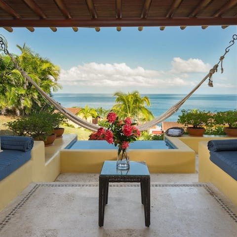 Swing in the hammock, cocktail in hand, and admire the ocean views