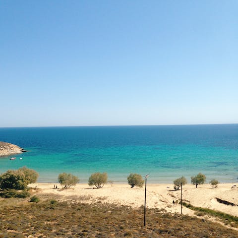 Drive four minutes or walk twenty to Leftos Gialos beach