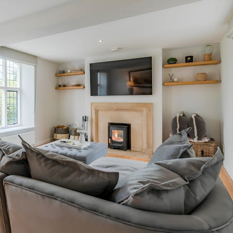 Warm up by the fire in the cosy snug