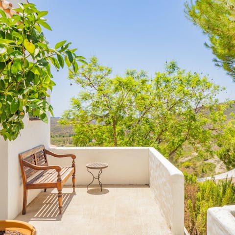 Relax on the sun-kissed terraces and admire the sweeping scenery