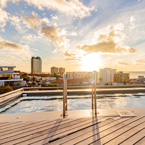 Take a refreshing dip in the communal pool and enjoy the lovely views from the rooftop deck
