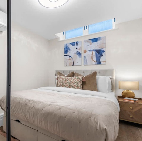 Sink into the comfortable bed after a busy day exploring London