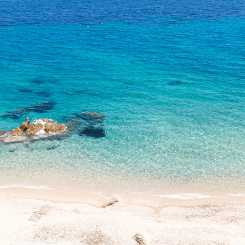 Head to the nearest sandy beach, Zorba Beach is a five-minute walk