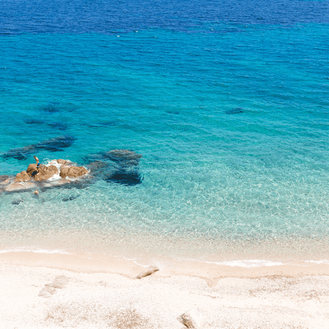 Head to the nearest sandy beach, Zorba Beach is a five-minute walk
