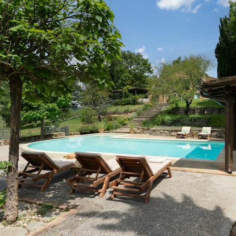 Drink in the Tuscan sun from beside the private pool
