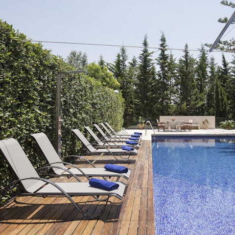 Spend your days lounging by the pool under the sun