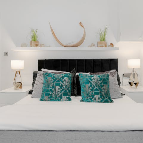 Get some rest in the orchid festooned bedroom after a busy day in London