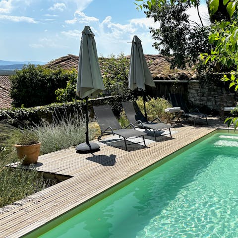 Lounge by the private pool on a warm day