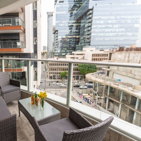 Sip on a glass of red on the balcony