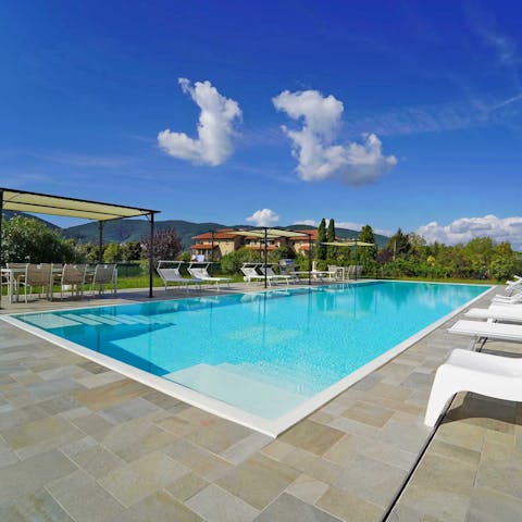 Slip slowly into the swimming pool via submerged steps