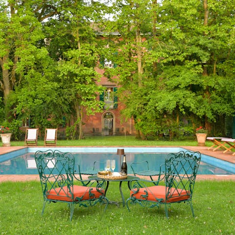 Relax by the pool with a glass of wine