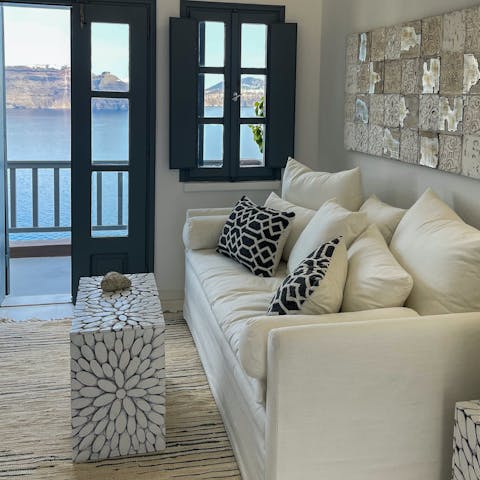 Curl up on the sofa while admiring the stunning sea views