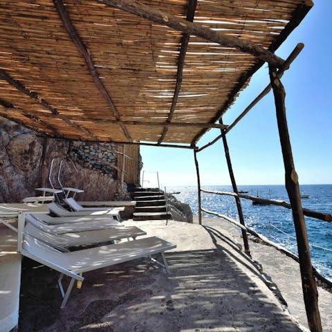 Dip your toes into the sea on the shared beach