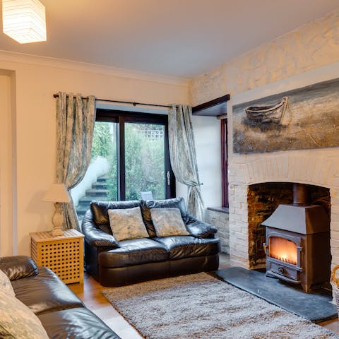 Cosy up on the leather sofas and toast by the log-burning fireplace