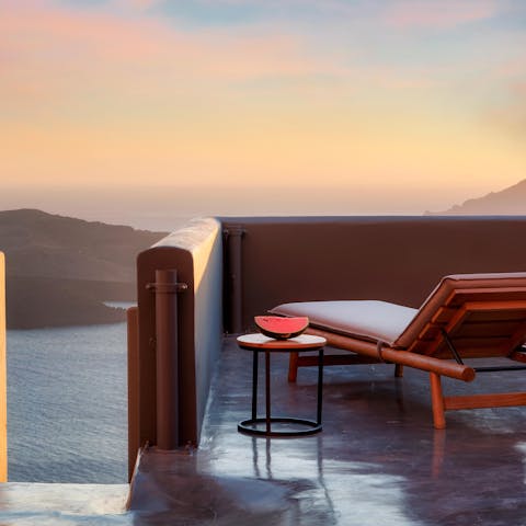 Lie back in the lounger on the terrace as you gaze out to sea views