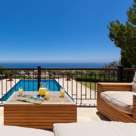 Enjoy cocktail hours and watch the sunset over the ocean