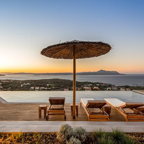 Sprawl out with a glass of wine and watch the sun dip below the sea