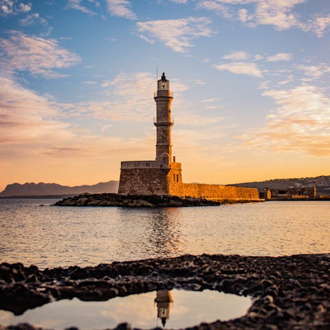 Take a day trip to Chania to see the lighthouse in the Venetian Port