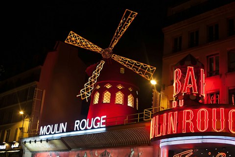 Discover Moulin Rouge, Paris's legendary Belle Époque cabaret venue, a fifteen-minute walk