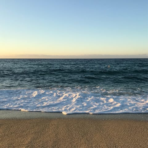 Catch the sun set down at Santa Maria Beach, just a short stroll away