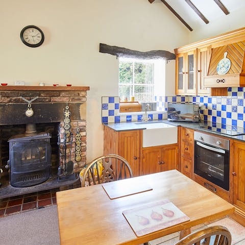 Whip up dinner in your kitchen and enjoy a hearty meal around the table while the fireplace crackles on