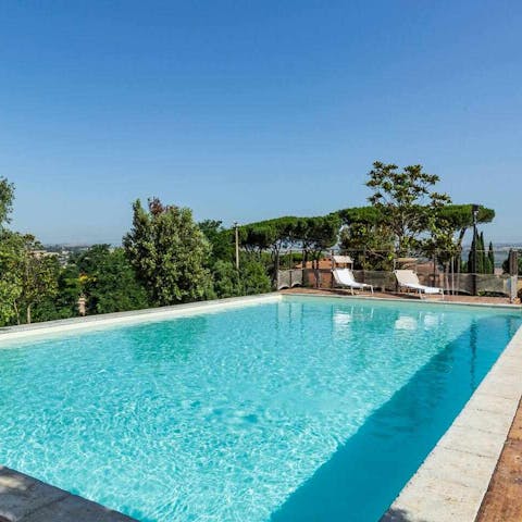 Take a dip in the glistening pool with stunning countryside views around you