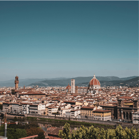 Admire views across Florence from Piazzale Michelangelo, sixteen minutes away on foot
