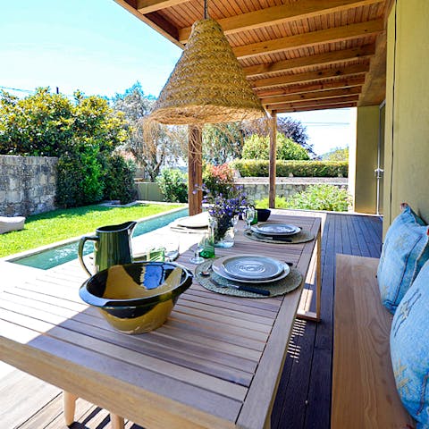 Drink or dine alfresco on the covered poolside terrace